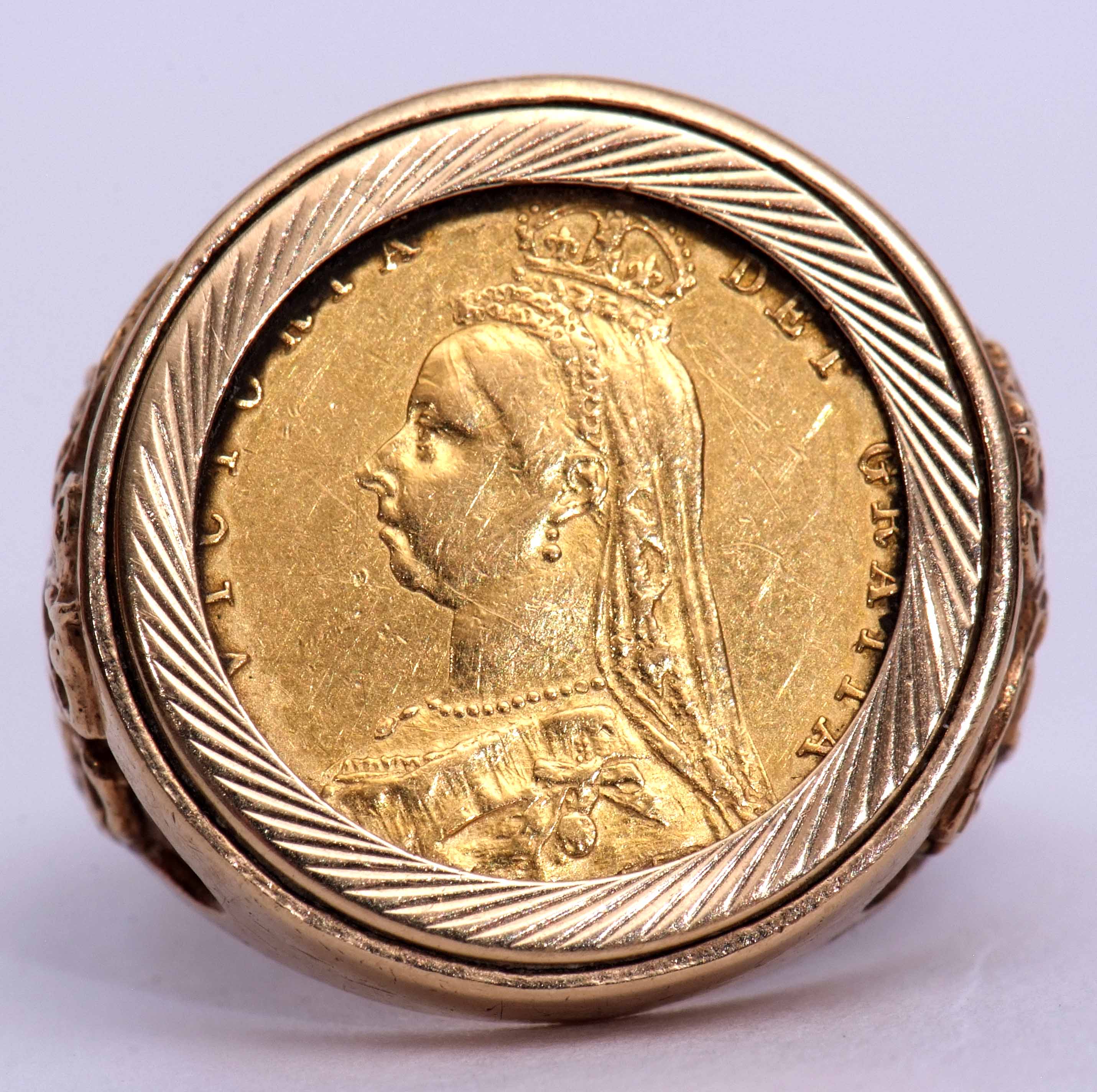 Victorian gold half sovereign shield back, dated 1887, in a 9ct gold ring mount, the shoulders