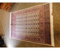 GOOD QUALITY MODERN BOKHARA CARPET WITH REPEATING LOZENGE AND CREAM GROUND WITH BLUE GEOMETRIC