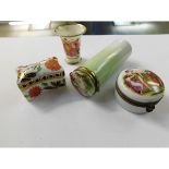 THREE LIDDED PORCELAIN STORAGE BOXES AND A FURTHER SMALL TRUMPET TYPE VASE