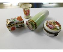 THREE LIDDED PORCELAIN STORAGE BOXES AND A FURTHER SMALL TRUMPET TYPE VASE