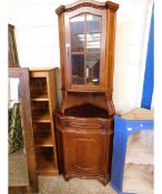 TEAK EFFECT FLOOR STANDING CORNER CUPBOARD WITH SINGLE GLAZED DOOR WITH OPEN SHELF, WITH SINGLE DOOR