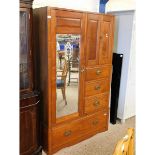 WALNUT WARDROBE WITH SINGLE MIRRORED DOOR WITH TWO PANELLED CUPBOARD DOORS FITTED WITH FOUR DRAWERS