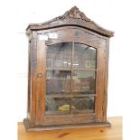 WALL MOUNTED OAK FRAMED CABINET WITH CARVED TOP