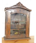 WALL MOUNTED OAK FRAMED CABINET WITH CARVED TOP