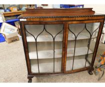 20TH CENTURY WALNUT BOW FRONTED ASTRAGAL GLAZED DISPLAY CASE RAISED ON CLAW AND BALL FEET