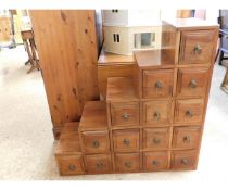 EASTERN HARDWOOD STEPPED 15-DRAWER CABINET WITH RINGLET HANDLES