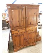 PINE FRAMED CABINET WITH FOUR DOORS WITH TWO DRAWERS WITH BRASS KNOB HANDLES