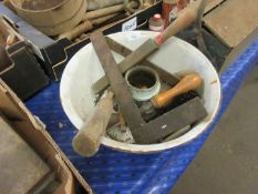 Vintage enamel mixing bowl containing assorted tools