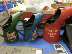 Oil can for Thelson tractor oils together with two others