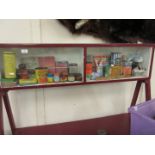 A fine and wide ranging collection of vintage packaging contained within a glazed display case,