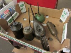 Five various small oil cans
