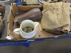 Box containing various vintage items including hessian sacks, gaiters, etc