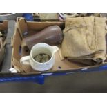 Box containing various vintage items including hessian sacks, gaiters, etc