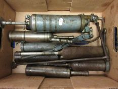 Box containing various grease guns etc