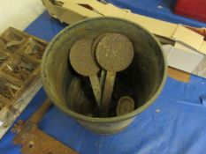 Bucket containing various markers