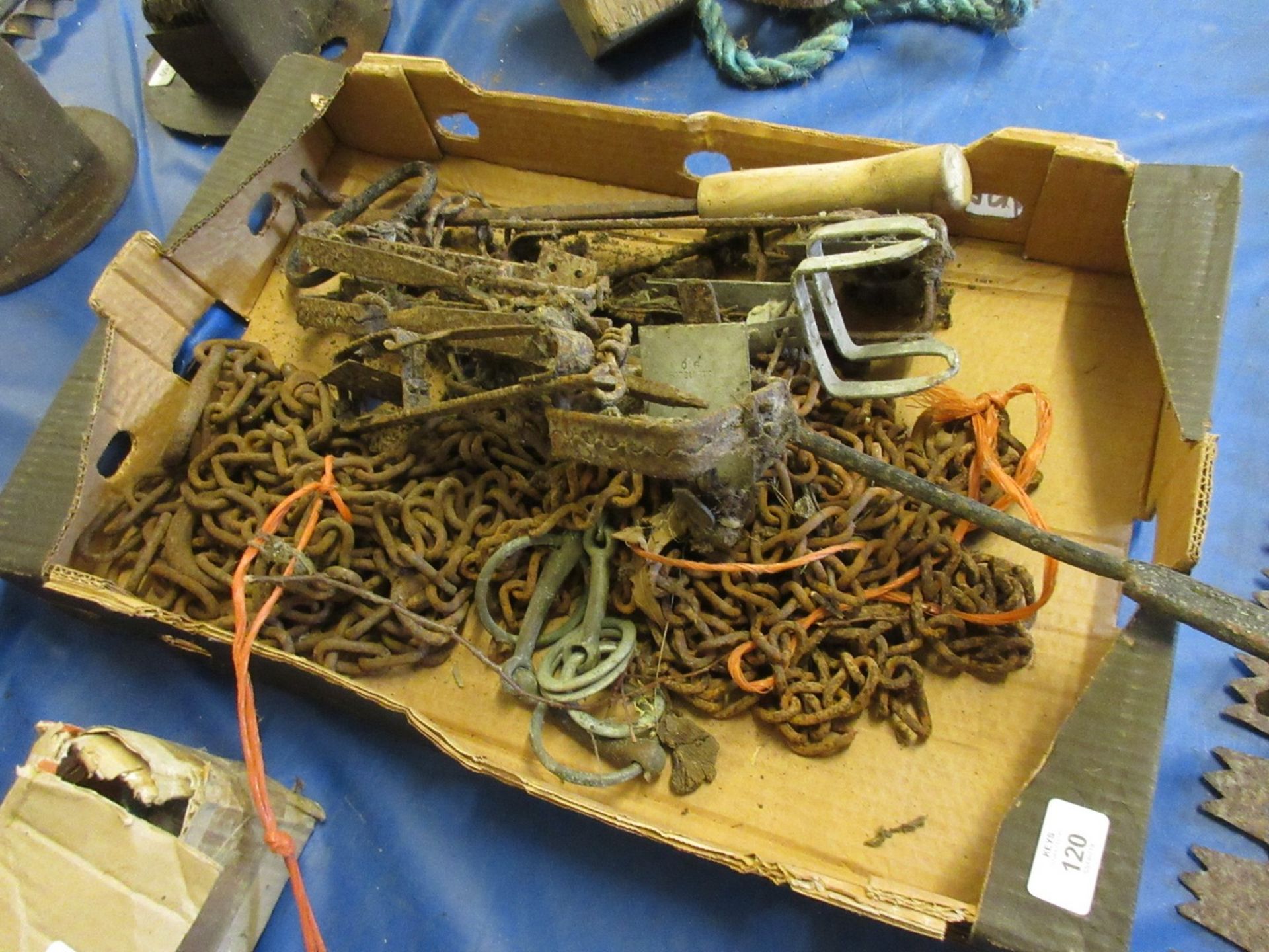 Box containing various traps, horse chains and bits, etc