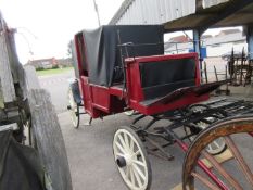 Vintage covered horse-drawn Carriage, fully restored and in recent use as a weddding hire vehicle.