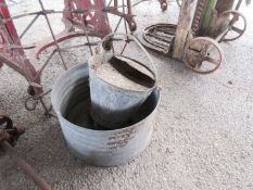 Large metal pot together with a Dairy bucket