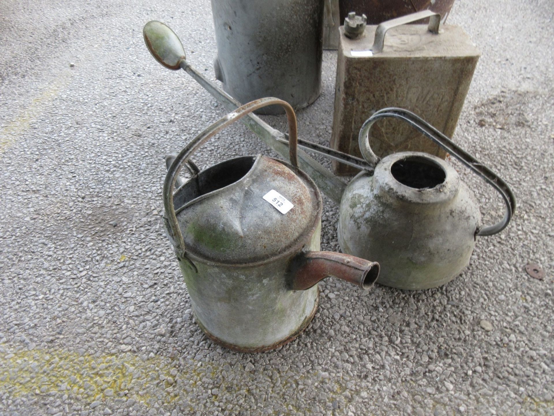 Two galvanised watering cans