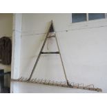 Large wooden framed hay rake