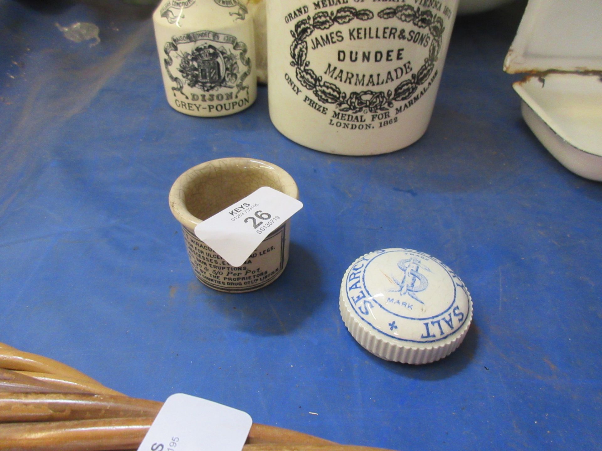 A transfer printed pot for Clarke’s miraculous salve, Together with a similar pot lid for Searcy’s