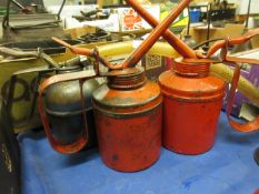 Three various oil cans