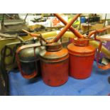 Three various oil cans