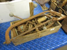 Wooden tool tray containing assorted metal tools, possibly binder-related