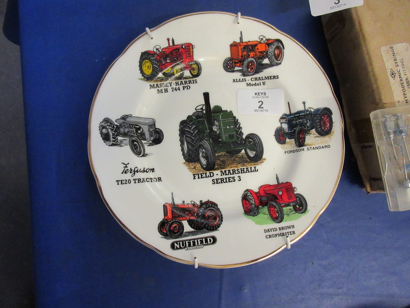 Collectors plate in English fine China featuring various vintage tractors including Massey Harris