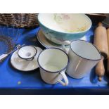 Three enamelled pieces comprising measuring jug, mug, and candleholder