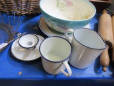 Three enamelled pieces comprising measuring jug, mug, and candleholder