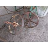 Two metal plough wheels
