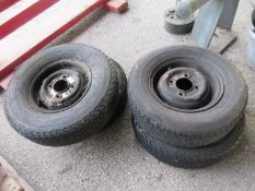 Four trailer or vintage car wheels