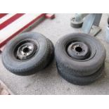 Four trailer or vintage car wheels