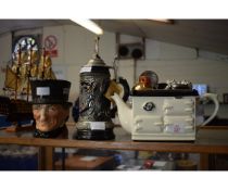 NOVELTY RANGE TEA POT, A FURTHER GERMAN BEER STEIN AND A DOULTON CHARACTER JUG OF JOHN PEEL