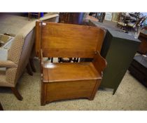 EARLY 20TH CENTURY OAK FRAMED METAMORPHIC MONK S BENCH WITH LIFT UP LID AND HINGED BACK