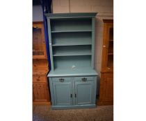 TURQUOISE PAINTED DRESSER WITH ADJUSTABLE SHELVES, THE BASE FITTED WITH TWO DRAWERS OVER TWO