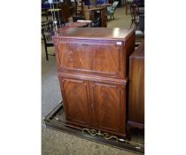 MAHOGANY EFFECT DROP FRONTED DRINKS CABINET OVER TWO PANELLED DOORS ON BRACKET FEET