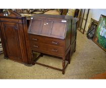 OAK FRAMED BUREAU WITH DROP FRONT AND TWO FULL WIDTH DRAWERS ON TURNED STAND