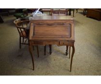 OAK FRAMED FRENCH STYLE DROP FRONTED BUREAU FITTED WITH TWO SMALL DRAWERS ON SHAPED SPINDLE LEGS