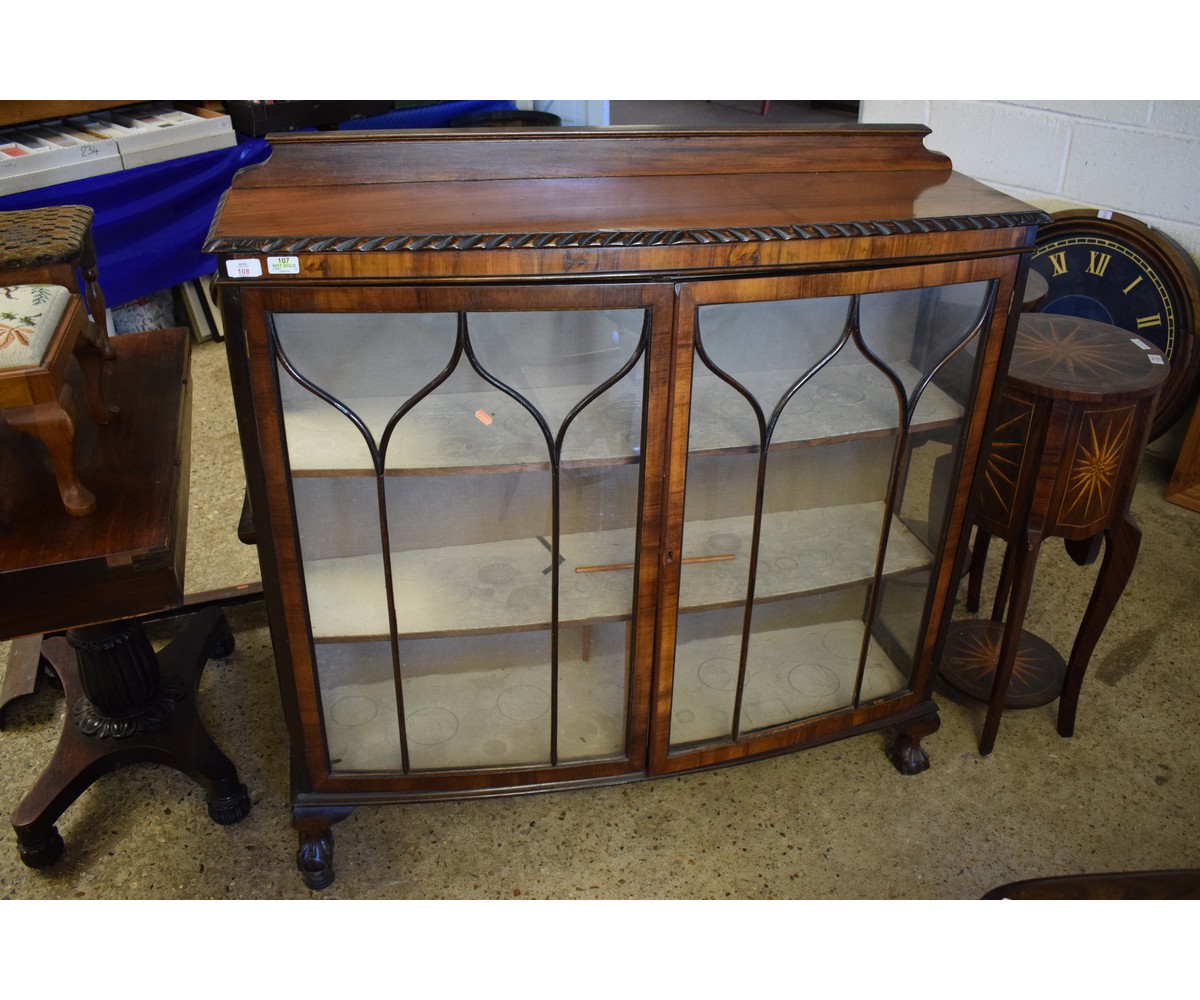 20TH CENTURY WALNUT BOW FRONTED ASTRAGAL GLAZED DISPLAY CASE RAISED ON CLAW AND BALL FEET