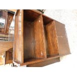 OAK FRAMED NARROW BOOKCASE WITH TWO OPEN SHELVES OVER PANELLED CUPBOARD DOORS