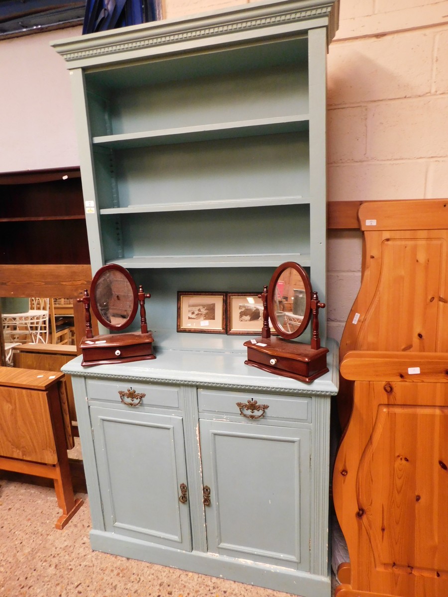 TURQUOISE PAINTED DRESSER WITH ADJUSTABLE SHELVES, THE BASE FITTED WITH TWO DRAWERS OVER TWO