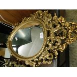 TWO RESIN LOZENGE SHAPED MIRRORS WITH PAINTED GOLD DETAIL (2)