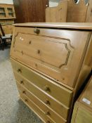 PINE FRAMED DROP FRONTED BUREAU FITTED WITH FOUR DRAWERS WITH KNOB HANDLES