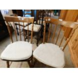 PAIR OF BEECHWOOD HARD SEATED STICK BACK KITCHEN CHAIRS