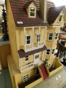 GOOD QUALITY THREE TIER DOLLS HOUSE IN VICTORIAN MANOR HOUSE STYLE