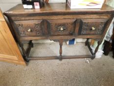 OAK FRAMED SIDEBOARD WITH THREE DRAWERS WITH CARVED DETAIL ON TURNED LEGS WITH BRASS KNOB HANDLES