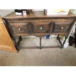 OAK FRAMED SIDEBOARD WITH THREE DRAWERS WITH CARVED DETAIL ON TURNED LEGS WITH BRASS KNOB HANDLES