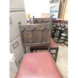 TWO MID-20TH CENTURY OAK GOTHIC EFFECT DINING CHAIRS WITH PANELLED BACK AND RED DROP IN SEATS